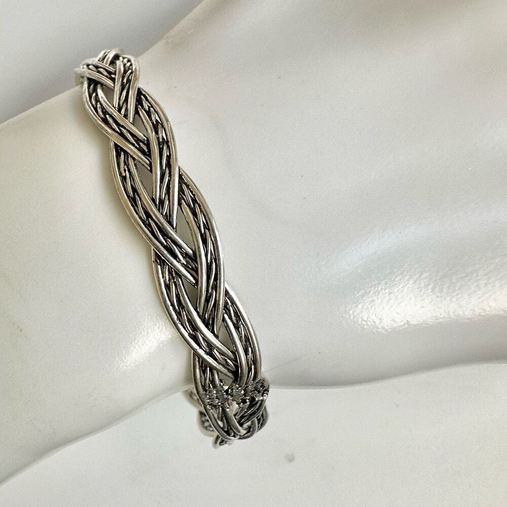 Silver tone braided bangle bracelet